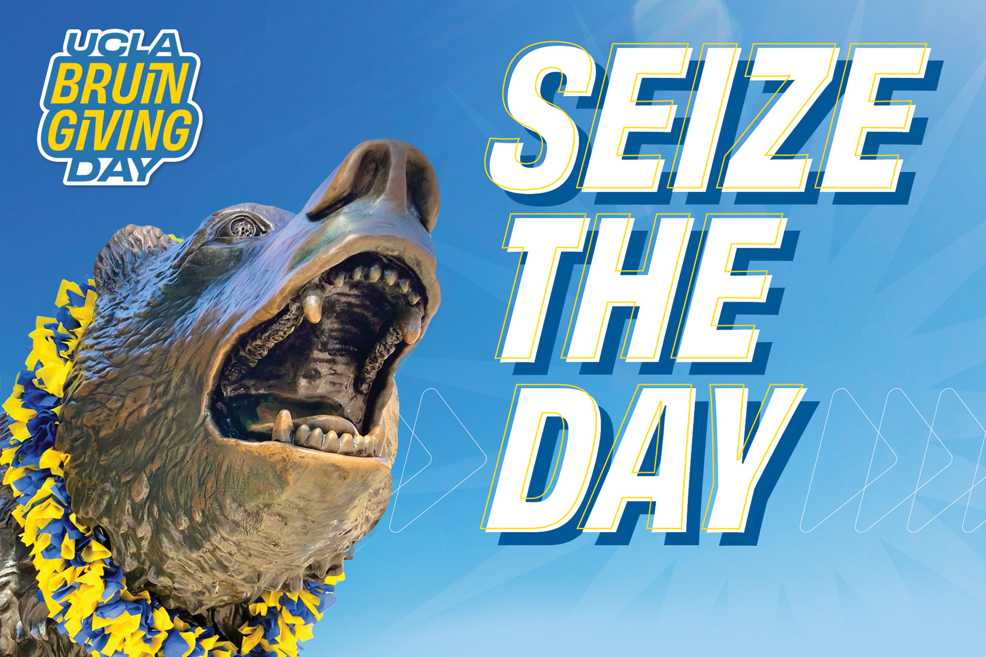 Image of UCLA Bruin Bear Statue with celebratory blue and gold lei.