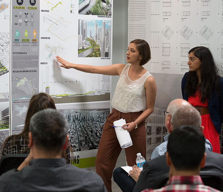 Two female students lead a comprehensive presentation.