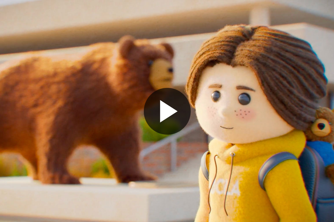 Hand picking up a picture frame with an image of a construction worker